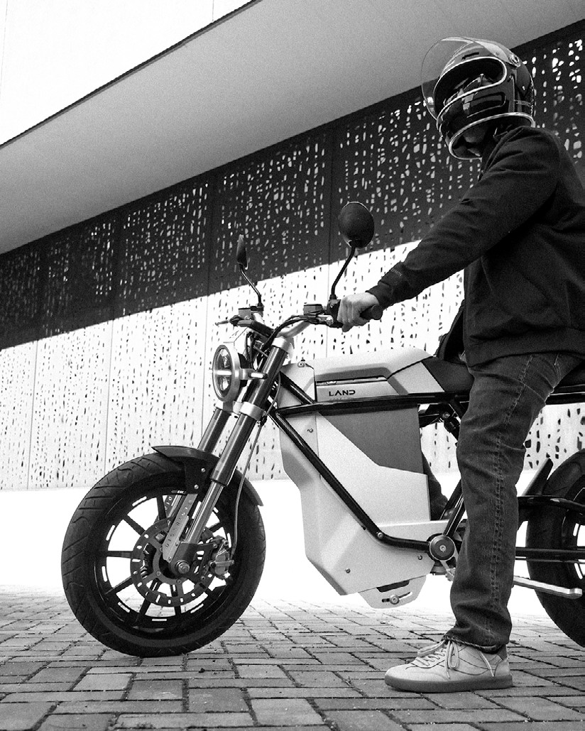 Electric motorcycle prototype lit in low-key studio lighting